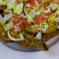 Traditional Taco Salad · Seasoned chicken or beef on mixed greens with tomatoes, purple onion, black olives, and chee...