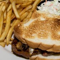 Philly Swiss Steak Sandwich · Thin sliced steak, onions, green peppers with melted Swiss on hoagie bun.