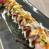 Shrimp Tempura Roll · Inside: Shrimp tempura, avocado, cucumber | Toppings: Eel sauce