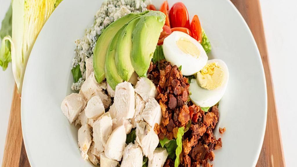 Cobb Salad · Fresh chopped romaine, egg, avocado, crispy diced bacon, oven roasted chicken, crumbled blue cheese, fresh sliced grape tomatoes, ranch dressing