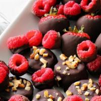 Chocolate Dipped Raspberries & Bananas · Loads and loads of mixed fresh raspberries & bananas dipped in Chocolate sprinkled with pecans
