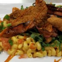 Majestic Mac N Cheese · Cavatappi pasta tossed in our house made cheese sauce, topped with arugula, crispy chicken s...
