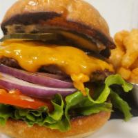 Mmmerica Burger · 1/4 lb burger, lettuce, tomato, onion, house pickles, cheddar cheese, and garlic chili aioli...