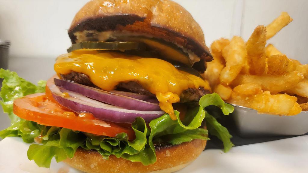 Mmmerica Burger · 1/4 lb burger, lettuce, tomato, onion, house pickles, cheddar cheese, and garlic chili aioli on a brioche bun. Served with fries.