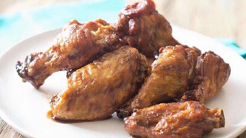 Bone In Wings · Wings are deep-fried and served with your choice of sauce on the side or tossed.