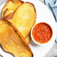 Side Of Garlic Bread · 2 slice of garlic bread with marinara sauce on the side