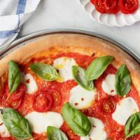 Margherita Pizza · Fresh mozzarella, basil, tomato.