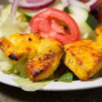 Chicken Entree · Marinated boneless chicken breast served with with a grilled tomato and choice of salad, ric...