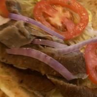 Gyro Wrap · Our famous hand carved beef and lamb gyro served in a pita bread wrap with lettuce, tomato a...