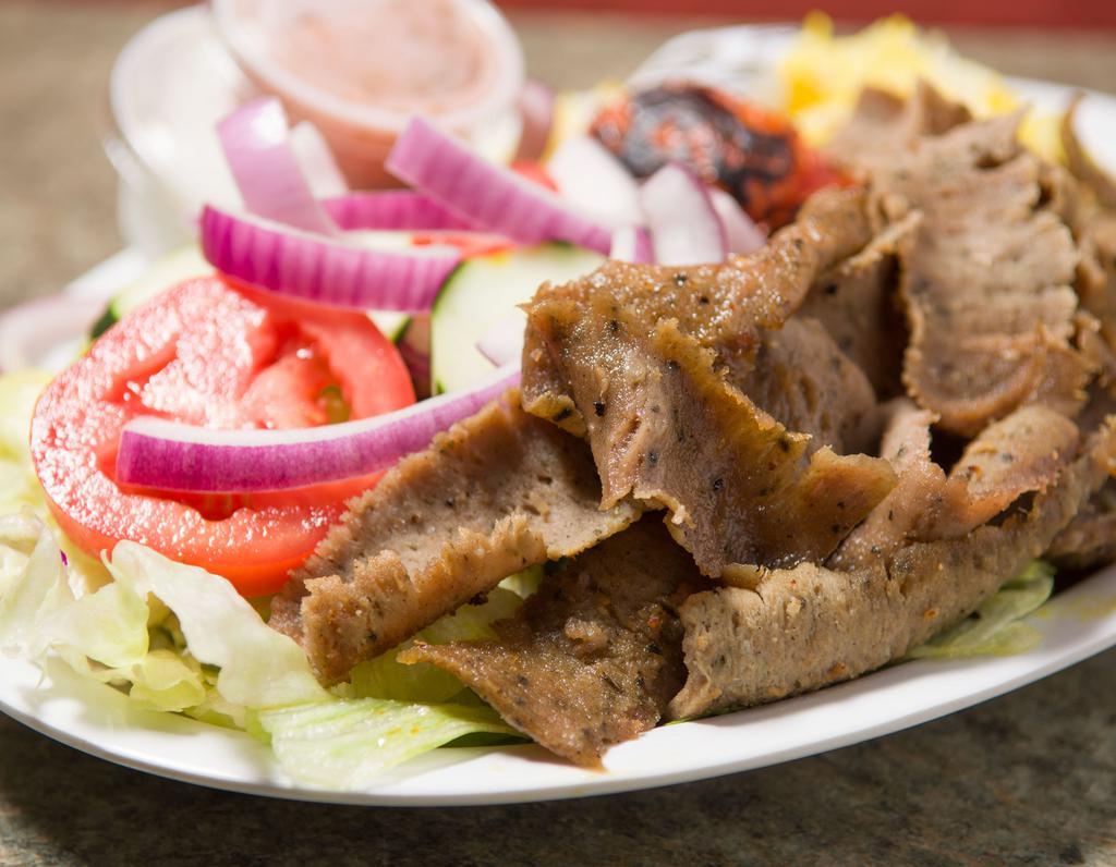 Gyro Entree · Our famous hand carved beef and lamb gyros served with with a grilled tomato and choice of salad, rice or half salad and half rice.