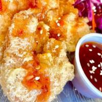 Dynamite Shrimp · 6 tempura shrimp tossed in a sweet and spicy chili sauce with cabbage slaw.
