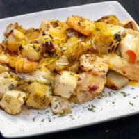 Seafood Big Baby Fries · Smothered potatoes topped with beef sausage, shrimp, salmon, green peppers, onions and cheese.