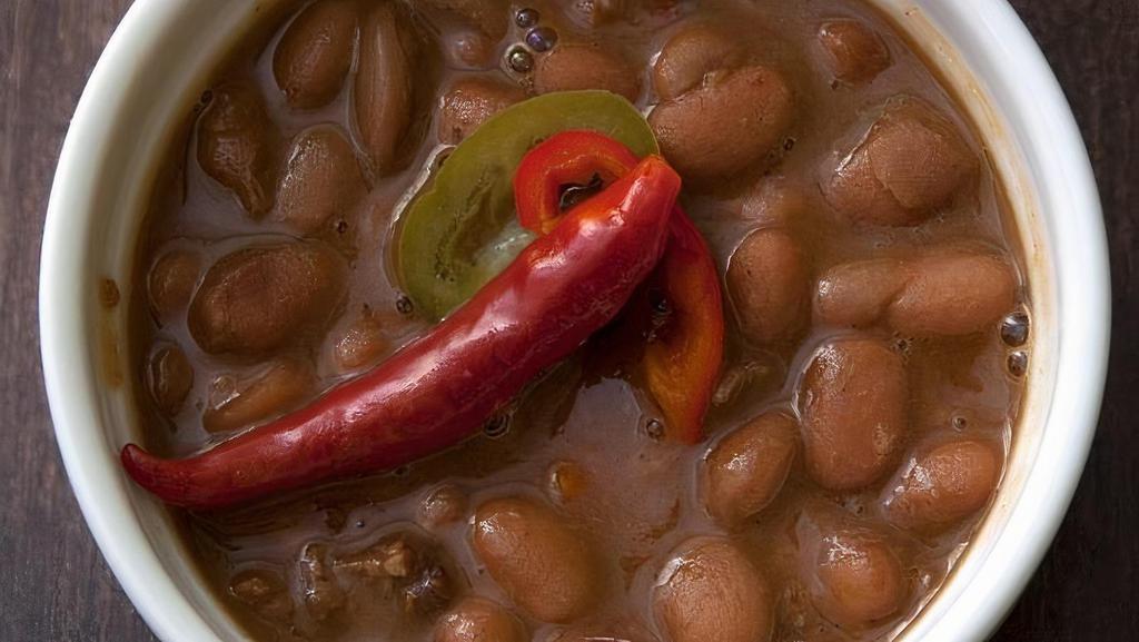 Slow Smoked Beans - Delivery · pinto beans | smoked with pork | onions | garlic | spices