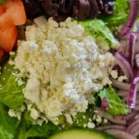 Greek Salad · Lettuce, Tomatoes, Red Onions, Cucumber, Kalamata Olives & Feta Cheese.