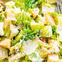 Caesar Salad · Romaine Lettuce, Parmesan Cheese & Stick Croutons.