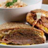 Cubano Sandwich · slow roasted pulled pork / fire roasted ham / swiss cheese / . beer mustard / deli pickles /...