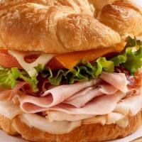 Deli Sandwich · Turkey on croissant with cheese, lettuce, tomato, onions and ranch dressing.