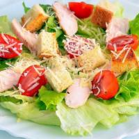 Caesar Salad · This salad would make Caesar proud! Romaine lettuce and croutons dressed with parmesan chees...
