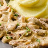 Beef Stroganov · A truly traditional Russian dish. Strips of beef sauteed in a garlic sour cream sauce. Usual...