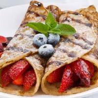Blini W/Fruit · Two crepes rolled around cream cheese, covered with a variety of fruits and berries, then to...