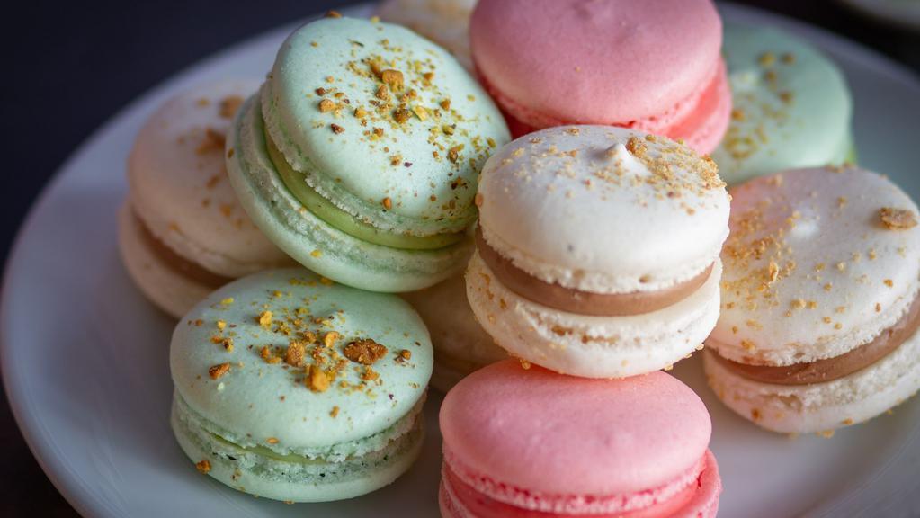French Macaroon · Macarons is a sweet meringue-based confection made with egg white, icing sugar, granulated sugar,  ground almond, and food coloring. (strawberry,almond,nutella,pistachio)