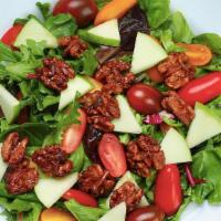 The Walnut Salad · Baby mixed greens, sliced apples, caramelized walnuts, heirloom baby tomatoes, lemon vinaigr...