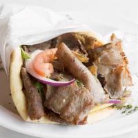 The Original Gyro Sandwich · Beef and lamb meat shaved off of a vertical rotisserie on a pita bread topped with lettuce, ...