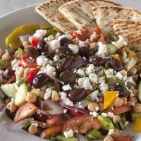 Mediterranean Chickpea Salad · Chickpea’s, mixed peppers, red onion, cucumber, and fresh tomatoes topped with feta, peppero...