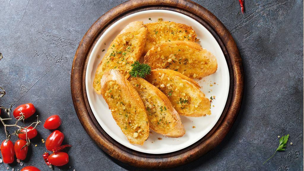 Garlic Aroma Bread · (Vegetarian) Housemade bread toasted and garnished with butter, garlic, and parsley.