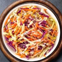 Coleslaw Abiding · (Vegetarian) Shredded cabbage and carrots dressed in mayonnaise and apple cider vinegar.