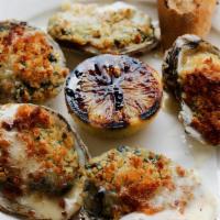 Oysters Rockefeller · 5 wild oysters on the half shell stuffed with caramelized celery & onion, spinach, chili fla...