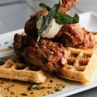 Waffles And Chicken · 2 fried chicken leg quarters, cornbread waffle, maple brown butter, fried sage