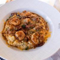 Shrimp And Grits · Andouille sausage, yellow stone ground grits, Cajun spice, bourbon, sharp cheddar cheese, fr...