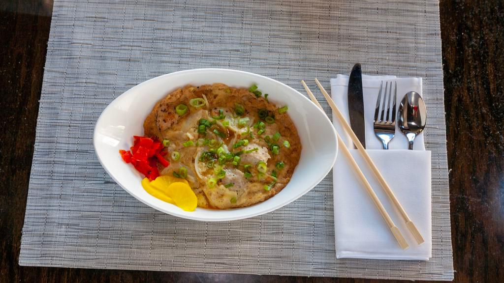 Oyako Don · Chicken, egg, onion, and scallion over rice. Served with Japanese pickles.
