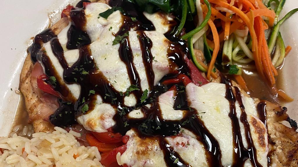 Nicki'S Healthy Chicken · Grilled chicken topped with prosciutto, red roasted peppers & fresh mozzarella drizzled with balsamic glaze.