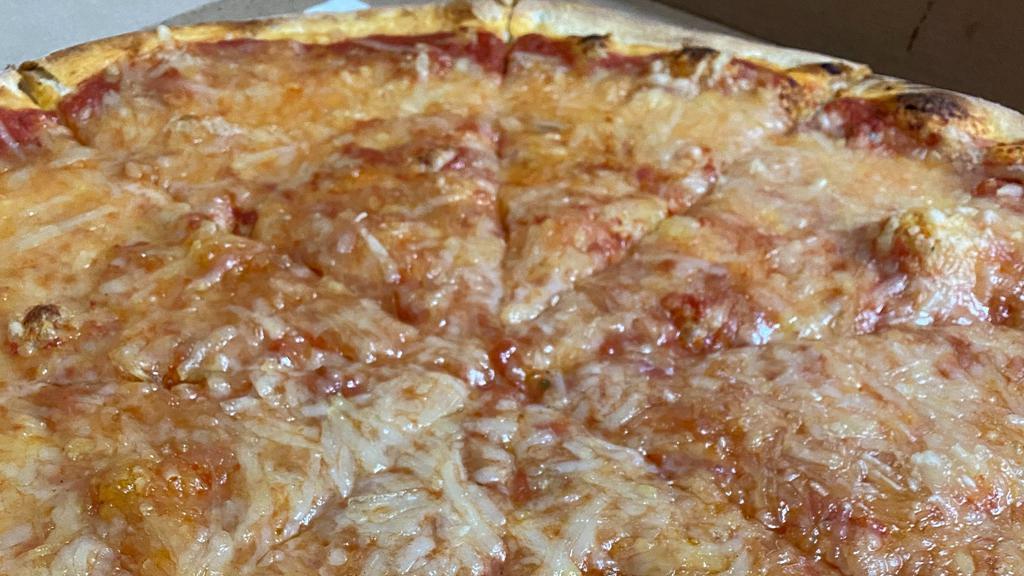 Vegan Classic Cheese Pizza · Vegan. Round pizza red sauce & 