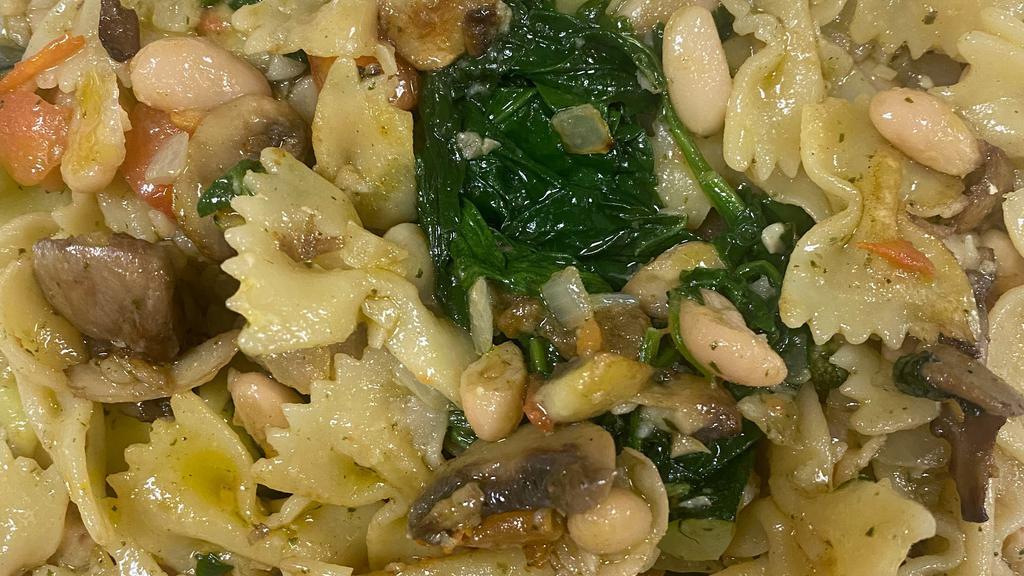Vegan Veggie Bowtie · Vegan. Bow tie pasta sautéed with garlic, zucchini, mushrooms, spinach, white beans & tomatoes.