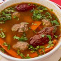 Albondigas · Meatballs in a spicy broth with Mexican spices, green onion, carrots and potatoes.