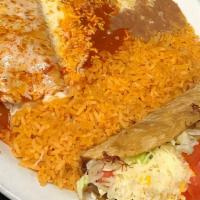 Two Items · Choice of shredded beef, chicken, pork or ground beef. refried beans and rice included.