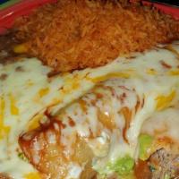 Super Flour Enchilada · A saucy enchilada made with choice of shredded beef or chicken rolled in a flour tortilla sm...