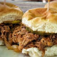 Pulled Pork Sliders · Three smoked pork sliders, served with Opal’s wicked sauce, caramelized onions & pickles.
