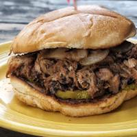 Pulled Pork Sandwich · Opal’s smoked pulled pork with onion, jalapeno, and pickle tossed in BBQ sauce. Served with ...