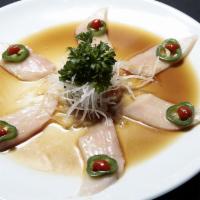Tear Drop Yellowtail · 6 pcs slices of yellowtail sashimi in ponzu with a fresh slice of jalapeno and a drop of sri...