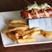 The Beyond Bratwurst W/ Chips · Vegan brat topped with vegan beer cheese and vegan slaw on a vegan pretzel roll.  Served wit...