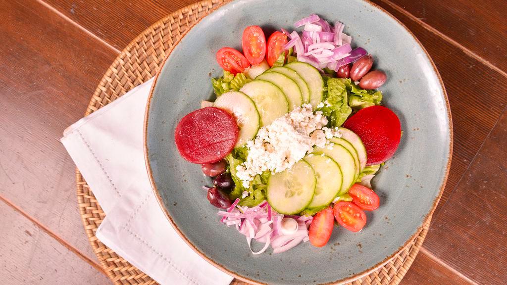 Greek Town Salad · Romaine, pickled beet, tomato, red onion, pepperoncini, cucumber, Feta, kalamata olive, and house Greek Vinaigrette.  Served with grilled pita.
