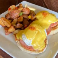 Eggs Benedict · Poached eggs, Canadian bacon, English muffin, hollandaise sauce and choice of potatoes or mi...