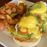 Garden Benedict · Fried green tomatoes, sautéed bell pepper and onion, avocado, poached eggs, english muffin, ...