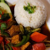 Tofu Or Spicy Tofu Rice Plate · Stir fry tofu with jalapeno, pepper, onion. Served with steamed rice, lettuce,  pickled carr...