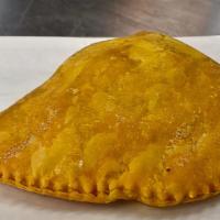Jamaican Beef Pie · Pastry that contains various fillings and spices baked inside a flaky shell, tinted golden y...