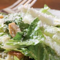 Caesar Salad · Romaine lettuce tossed with parmigiana Reggiano, house made croutons & Caesar dressing